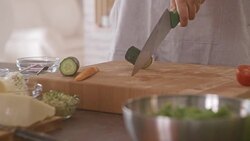 Chef cutting cucumber in the kitchen Stock Footage