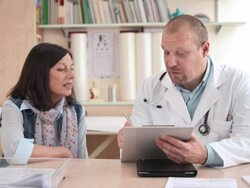 HD DOLLY: Doctor Interviewing A Woman Stock Footage