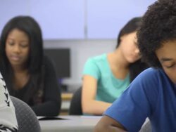 Multi-Ethnic Students in Classroom - front focus Stock Footage
