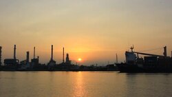 Oil Refinery Site While the Cargo ship through Stock Footage