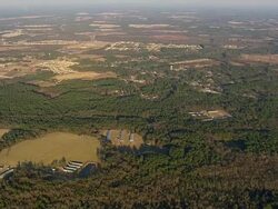 WS AERIAL View of farm field and town / North Carolina, United States Stock Footage