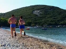 HD: Jogging On The Beach Stock Footage