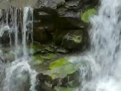 ECU Detail of Hoopii Falls and moss covered rocks / Kapaa, Kauai, Hawaii, United States Stock Footage