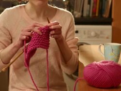 CU TU Shot of Woman knitting sitting at kitchen table / London, Greater London, United Kingdom Stock Footage