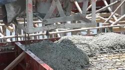 worker pouring concrete works at construction site Stock Footage