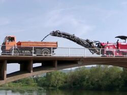 WS View of machines working over bridge construction site, preparing demolition of old bridge at Saar river / Wiltingen, Rhineland Palatinate, Germany Stock Footage