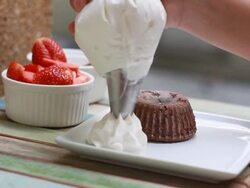 Chocolate cake with cream and berries Stock Footage