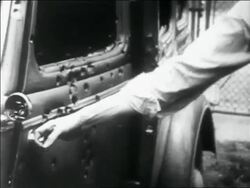 B/W 1934 close up PAN man's hand opening car door + sticking finger in bullet holes / Bonnie and Clyde Stock Footage