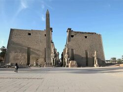 PINK GRANITE OBELISK AND FIRST PYLON OF LUXOR TEMPLE Stock Footage
