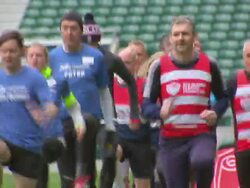 Prince Harry watching joggers warming up News Clip