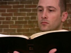 Man reading the bible Stock Footage