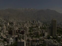 Locked of shot of Tehran skyline, mountains in background, Iran (sound available) Stock Footage