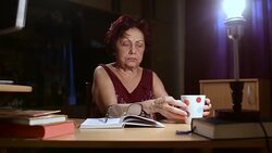 Grandmother reading a book Stock Footage