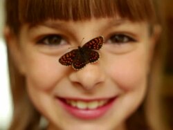 Girl with a butterfly on a nose Stock Footage