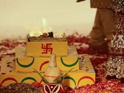 Bride and groom doing phere around havan kund  Stock Footage