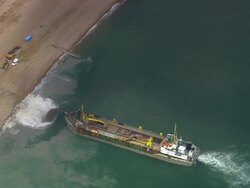 Aerial over dredger at work on Pevensey Bay / East Sussex, England Stock Footage