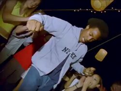 MS TD PAN Curly hair man dancing amongst other people / Portland, OR, United States Stock Footage