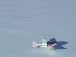 WS AERIAL View of Snow plane taking off/ Switzerland Stock Footage