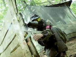 Paintball Player Shooting At Opponents Stock Footage