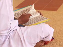 HD:Young man reading the Koran at the mosque. Stock Footage