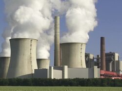 Coal Power Plant with Steaming Cooling Towers Stock Footage