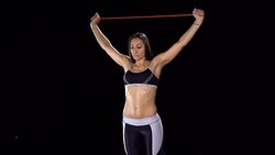 Stretching up with a resistance band Stock Footage