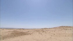 A vast desert dwarfs the ruins of Berenike, Egypt. Stock Footage