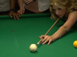 woman shooting pool with friends at a nightclub Stock Footage
