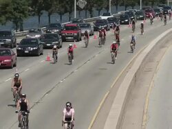 WS Cyclists on highway / Chicago, Illinois, USA Stock Footage