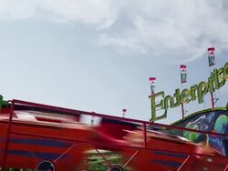 The Enterprise attraction ride spins wildly on the midway at a State Fair. Stock Footage