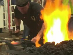 CU Shot of participators playing in blacksmith competition at Calgary Stampede / Calgary, Alberta, Canada Stock Footage