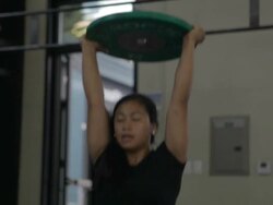 Close-up. Jonice performs series of overhead lunges. Stock Footage