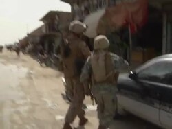 WS ZI Two soldiers distributing the placard on road / Mausa Qala, Helmand Province, Afghanistan. Stock Footage