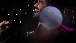 Excited celebrity cheers for paparazzi with Oscar statuette in backseat of limousine at awards show Stock Footage