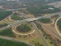 WS AERIAL View of Interstate 40 Highway 147 Intersection with wooded area / North Carolina, United States Stock Footage