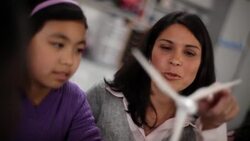 Teacher explains turbine to students Stock Footage