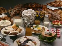 Table set with an assortment of breakfast foods Stock Footage