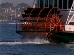 CU revolving paddles of paddle boat passing in front of Sydney Opera House, Sydney , Australia Stock Footage