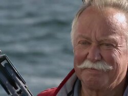 CU Happy pensioner sailing his boat at full speed / Wismar, Mecklenburg-Vorpommern, Germany Stock Footage