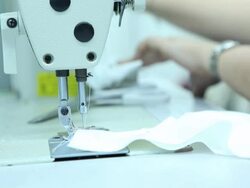 Female tailor working on sewing machine in factory Stock Footage
