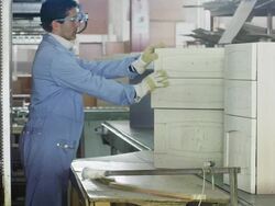 worker checking quality of cabinets ready for dispatch in furniture factory Stock Footage