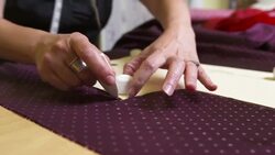 HD: Tailor Tracing A Sewing Pattern Stock Footage
