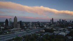 Elevated view over Interstate 85 passing the Midtown and Downtown Atlanta skyline, Georgia, United States of America Stock Footage