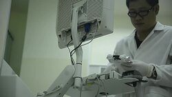 asia medical technician man working in laboratory hospital Stock Footage