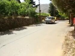 Small village vendors selling Hezbollah flags and music for rally attendess Stock Footage