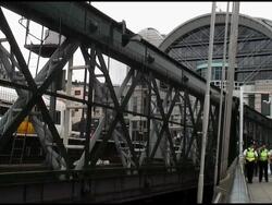 Coming and Going: London Police, Bobbies Walking By Train Stock Footage
