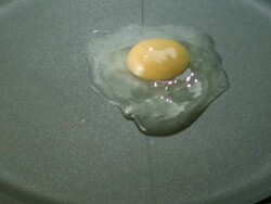 CU SLO MO Shot of boiled Fish Paste falling in to smoking frying pan with oil / Seoul, South Korea Stock Footage