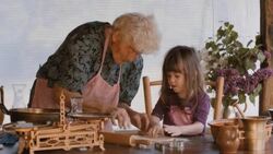 Cooking With Grandma-Beautiful Little Girl Learns How To Make Cookies  in The Bright-lit Vintage Kitchen Stock Footage