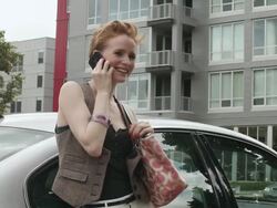 MS Young girl using cellular device outside next to her car on sunny day in urban area / Minneapolis, Minnesota, United States Stock Footage