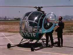 Men take off in helicopter Stock Footage